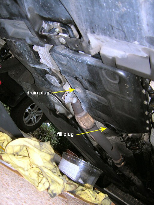 audi transmission pan with locations of fill and drain plugs labelled